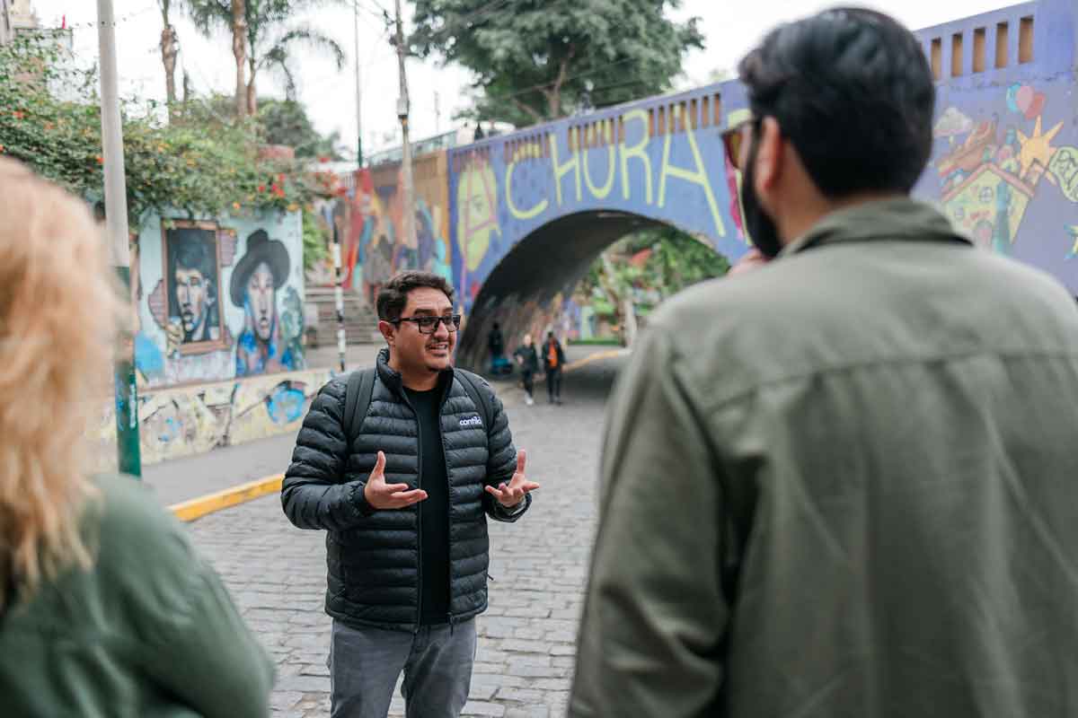 Tour Guide In Peru With Group Of Travelers