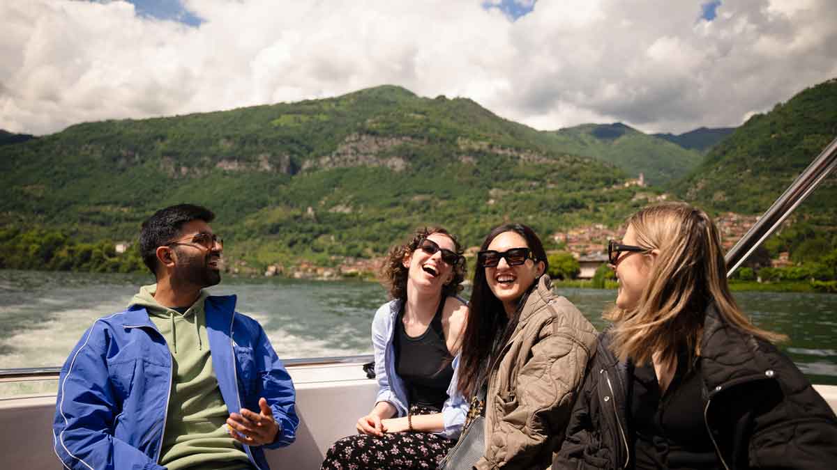 Travelers On A Boat On Lake Como