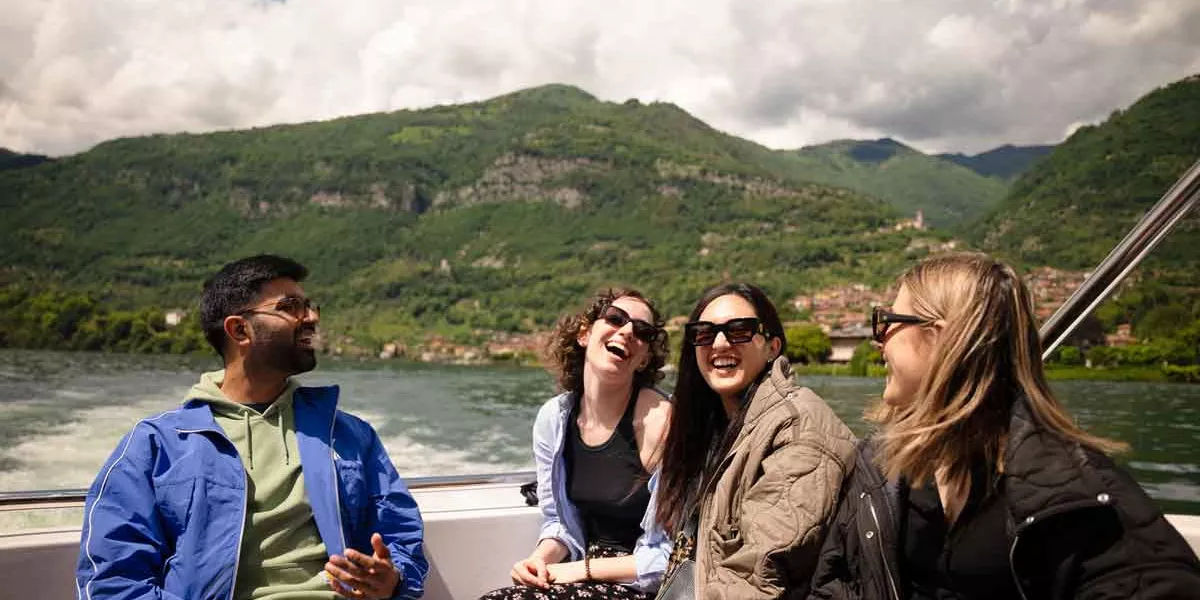 Travelers On A Boat On Lake Como