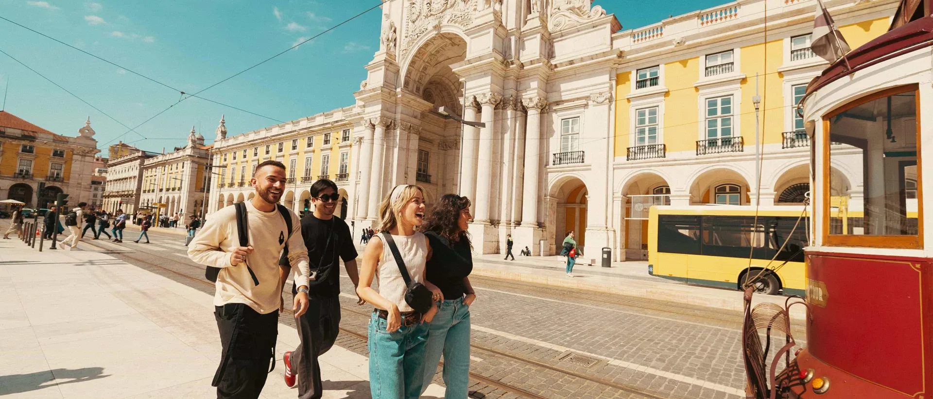 Travellers Walking Through Lisbon City Tram