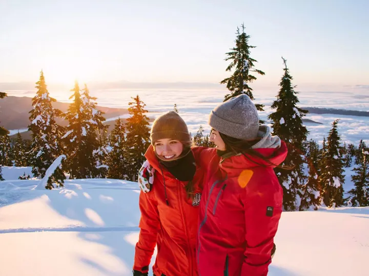 imgi_50_two-friends-smiling-snow-around-them.jpeg