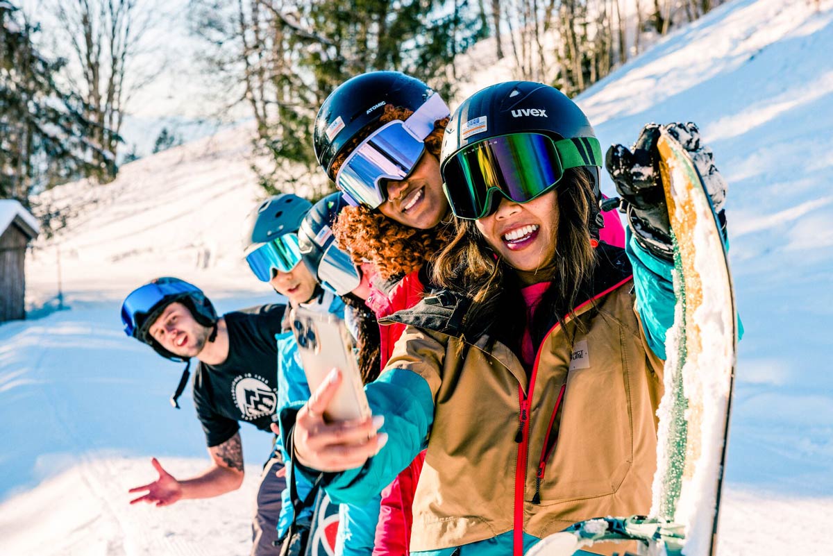 Young Friends Enjoying A Skiing Day Taking A Selfie