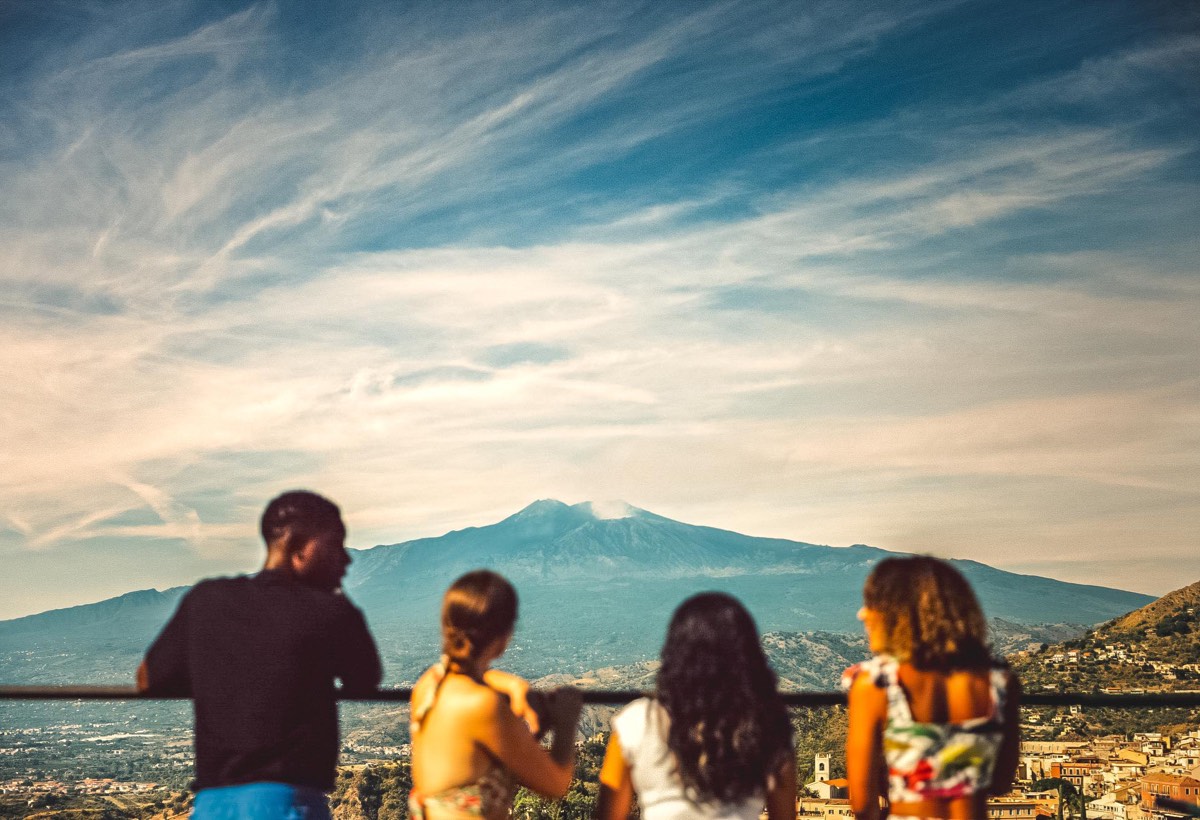 Travellers enjoying the volcano views in Sicily, Italy