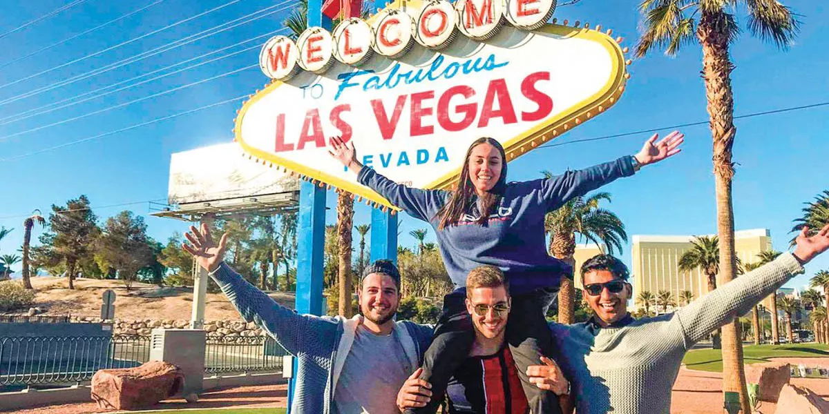 Group Of People In Front Of Las Vegas Sign