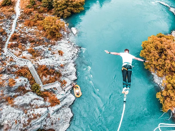 person jumping in to water