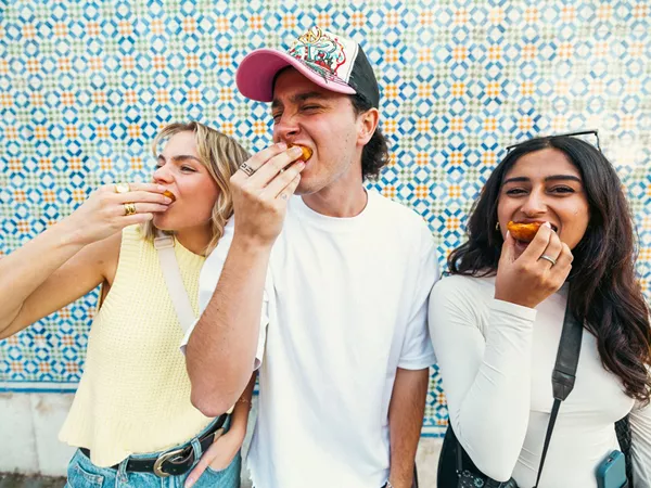 Three Young Friends Enjoying A Dessert