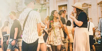 Contiki travellers enjoying gelato together in Piazza Navona, Rome, on the Rome to London Trail Tour