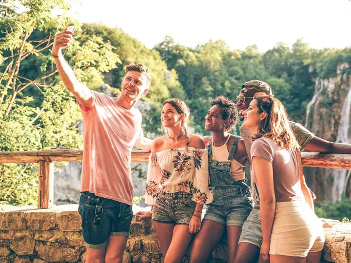 Group Young People Taking Selfie With A Nature Landscape At The Background