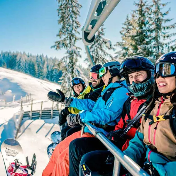 Group Heading On Mountains On Ski Lift Austria 0029EURS2023