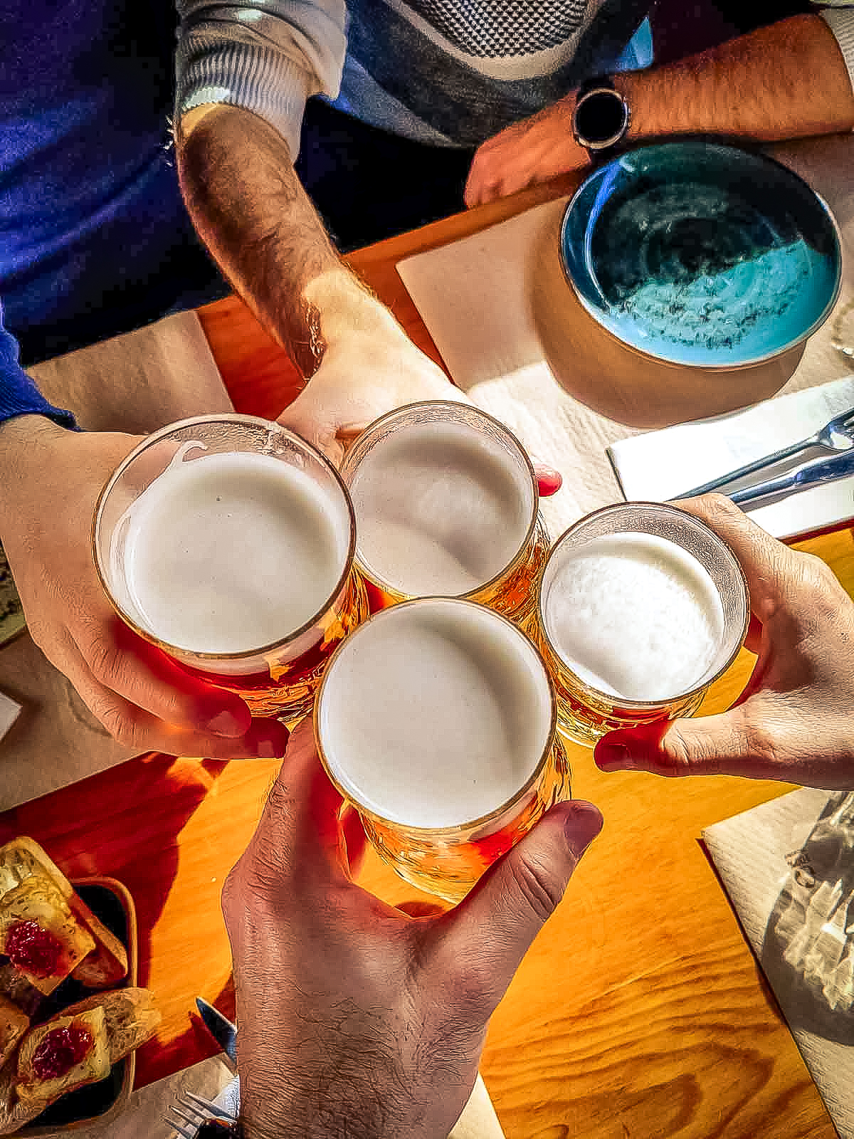 Travellers toasting a beer