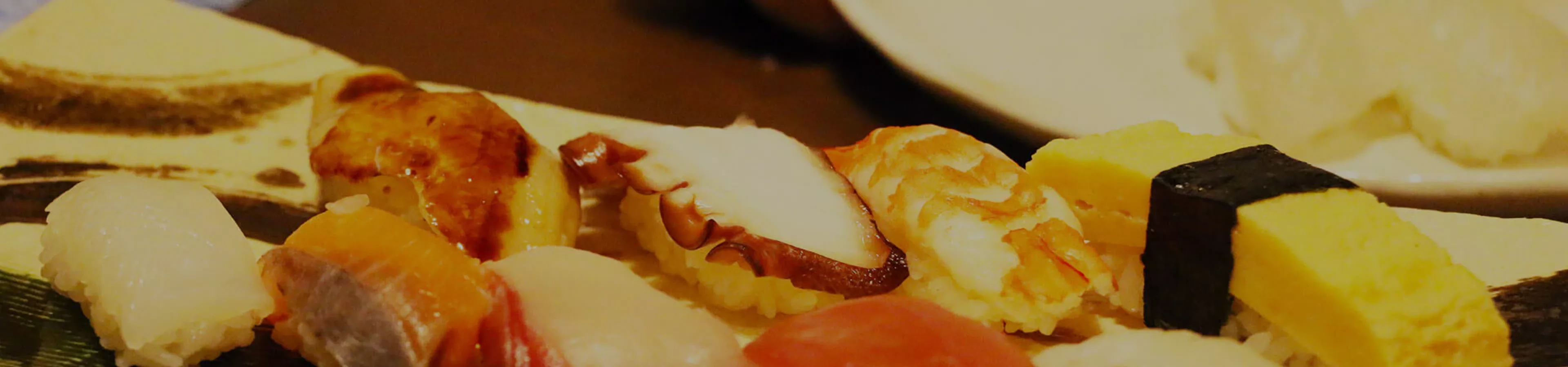 A close up of a plate of sushi
