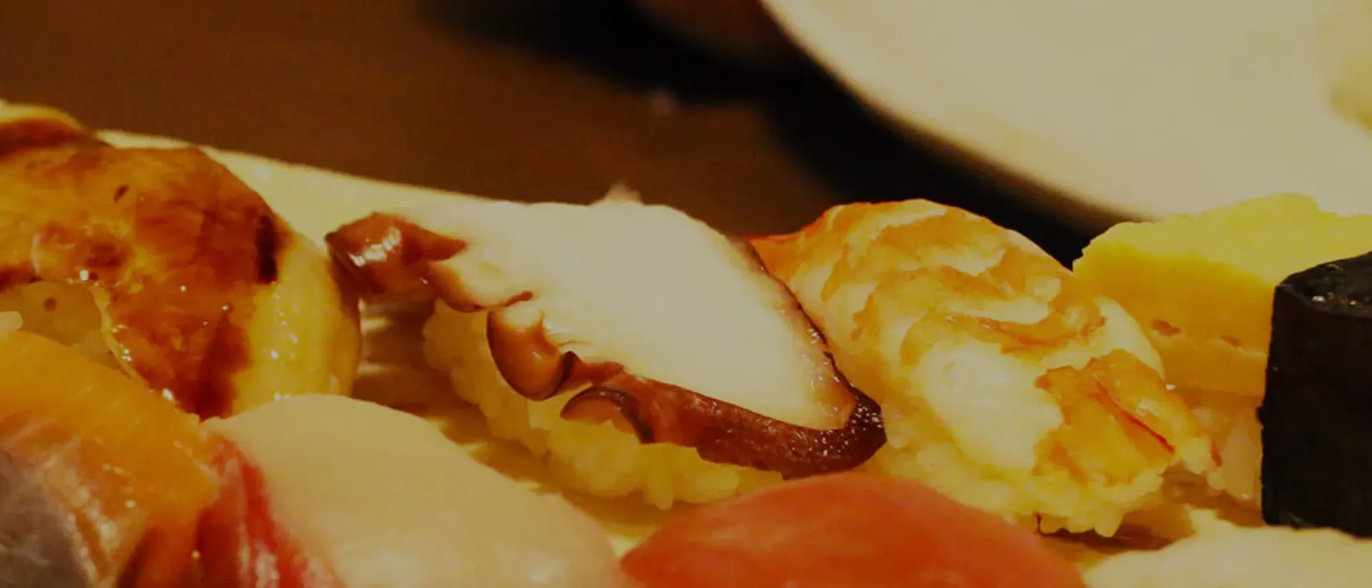 A close up of a plate of sushi