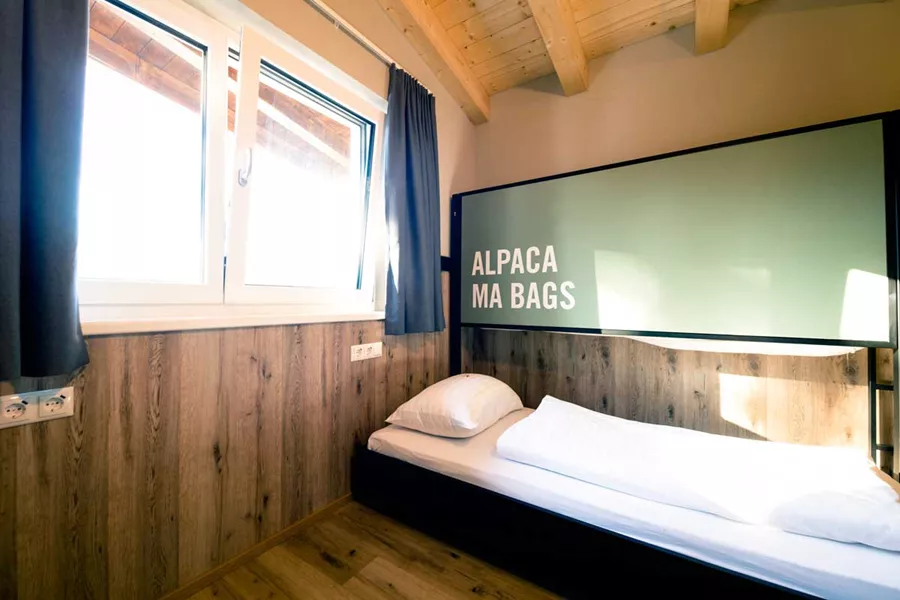 Bed in Alpaca Ma Bags Room At Gasthof Schoneck