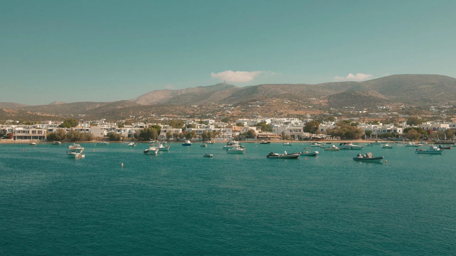 Boats anchored off the coast of Paros, Greece - Contiki's Best of Greece with Island Hopping Tour