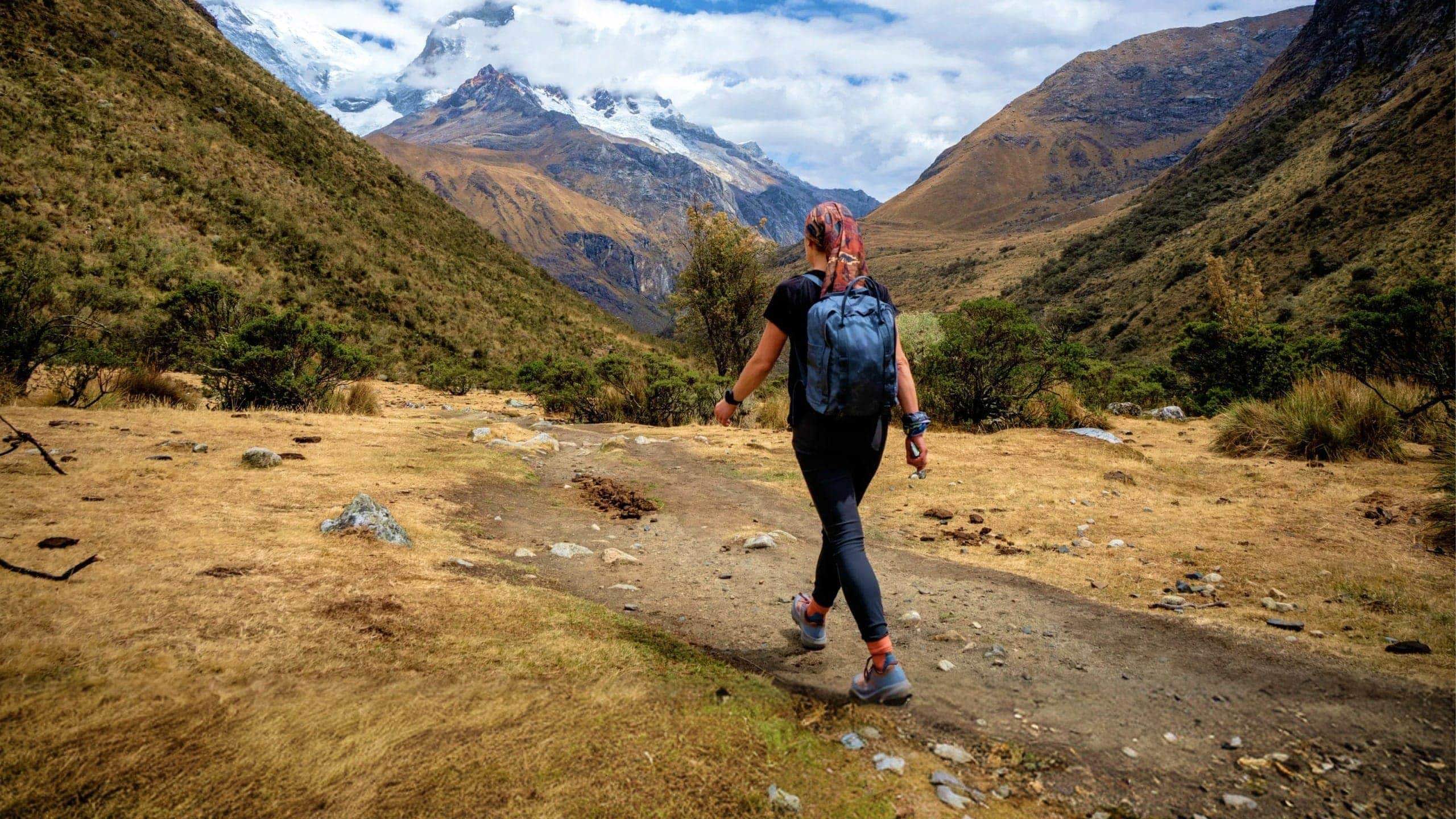 Traveller hiking through the Andes near Huaraz, Peru, on the Contiki Active Peru: Lima to Huaraz Tour