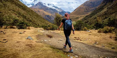 Traveller hiking through the Andes near Huaraz, Peru, on the Contiki Active Peru: Lima to Huaraz Tour
