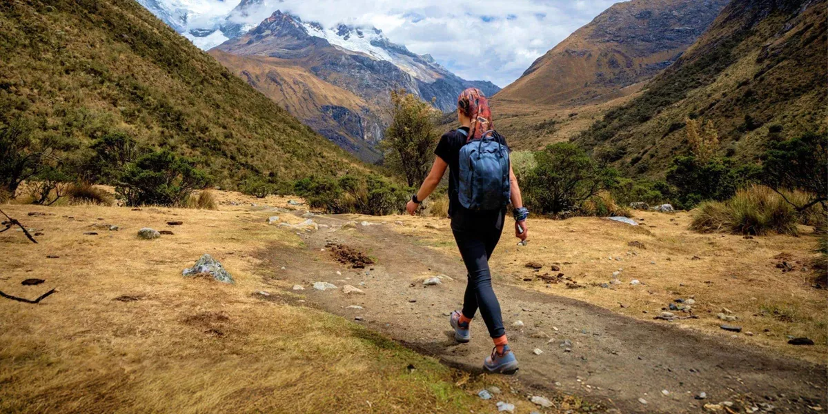 Traveller hiking through the Andes near Huaraz, Peru, on the Contiki Active Peru: Lima to Huaraz Tour