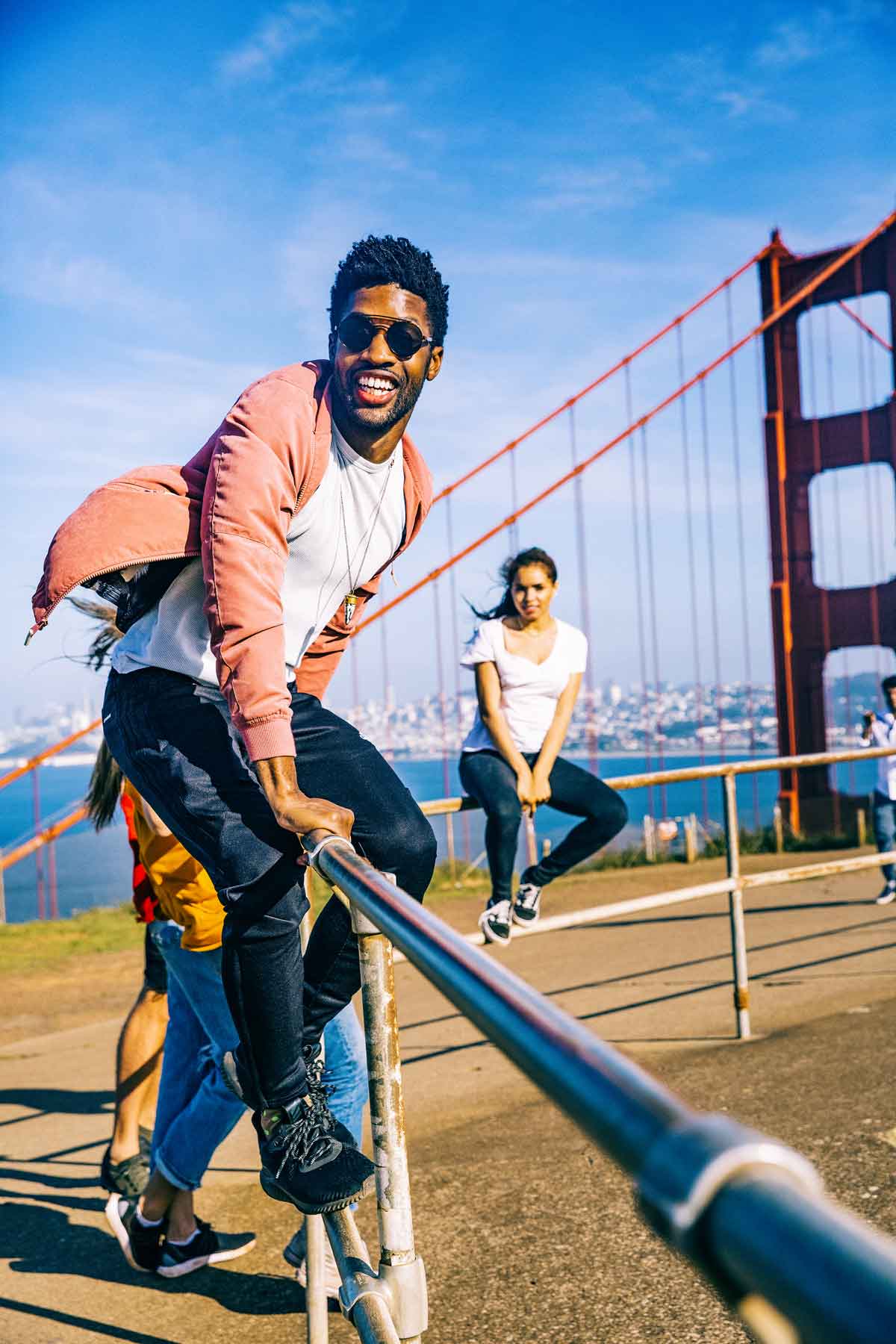 Group Having Fun On Golden Gate Bridge San Francisco