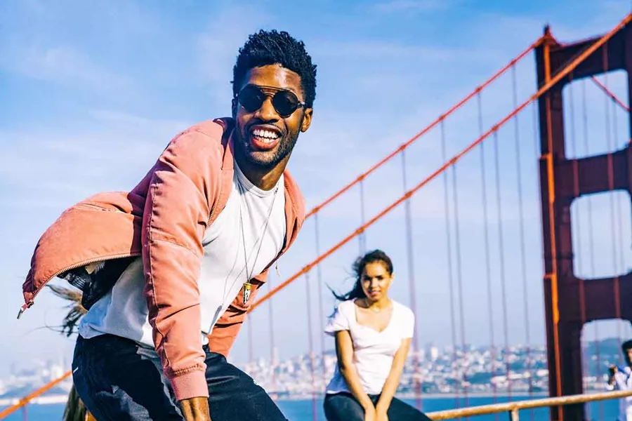 Group Having Fun On Golden Gate Bridge San Francisco