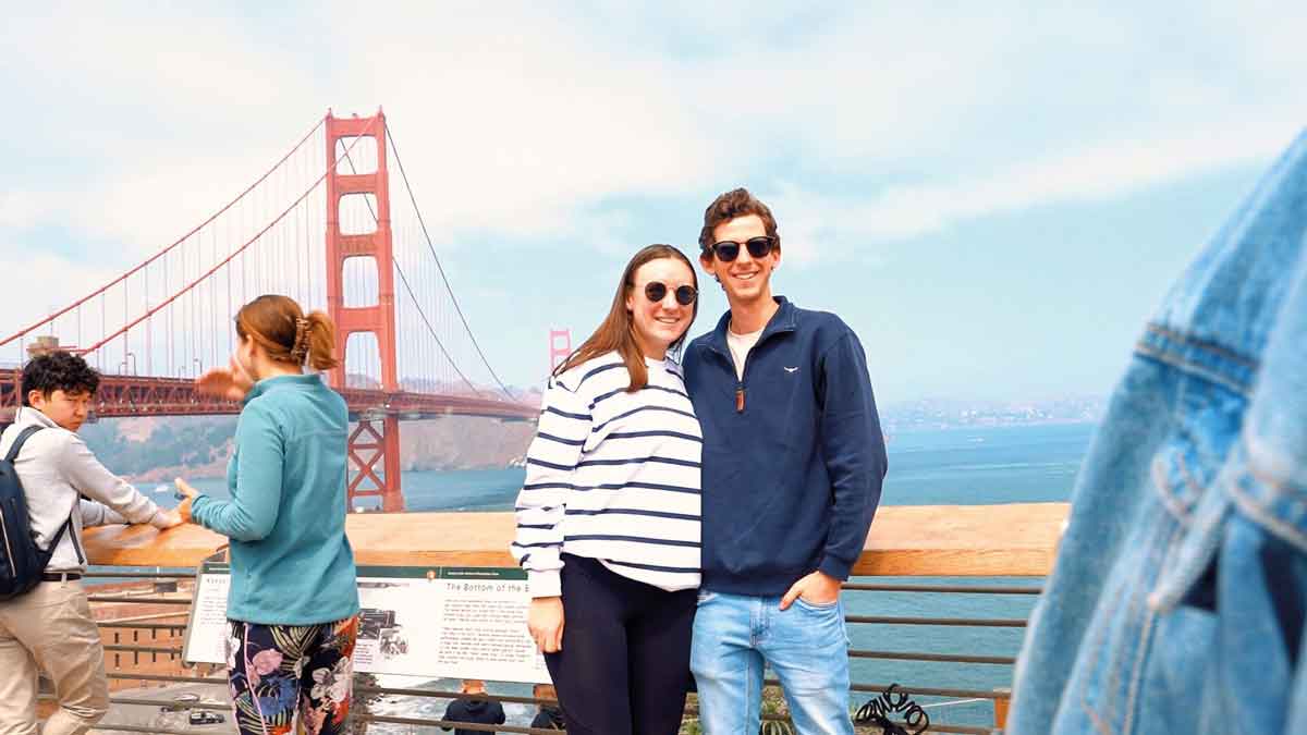 Couple Taking Picture In San Fransisco By Bridge