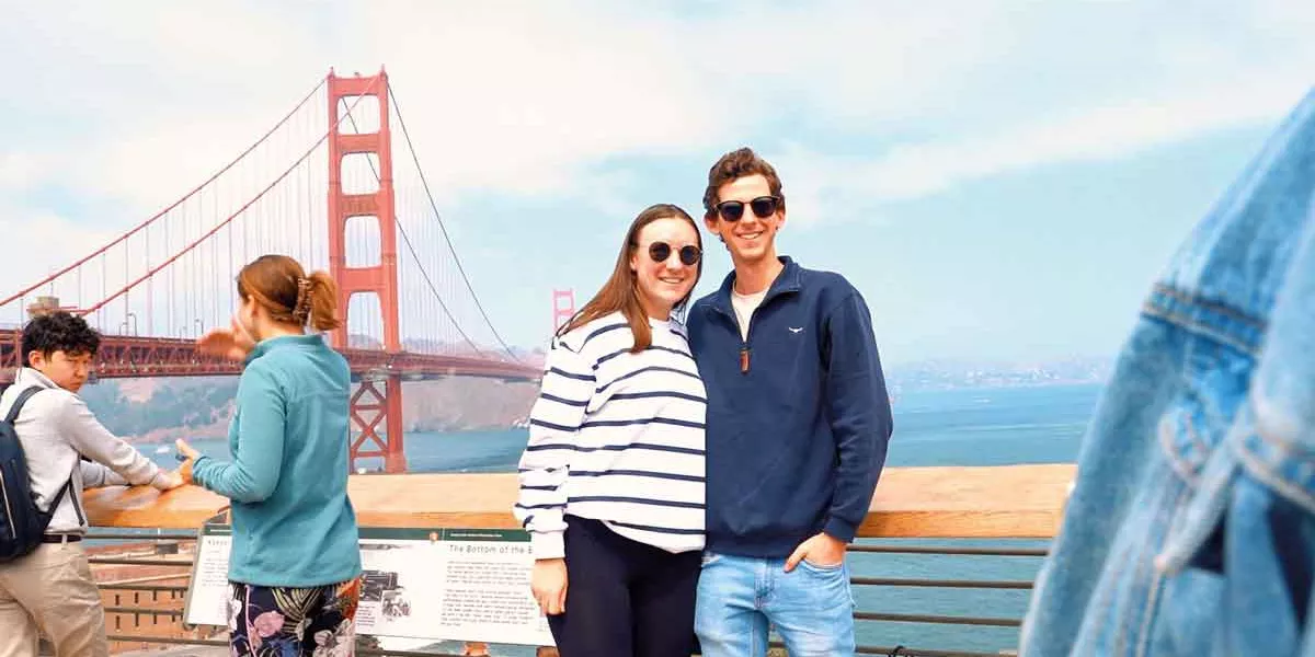 Couple Taking Picture In San Fransisco By Bridge