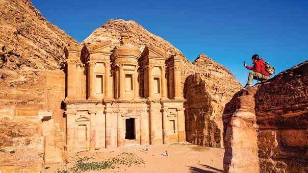 A Tourist Taking Picture of an Ancient Temple