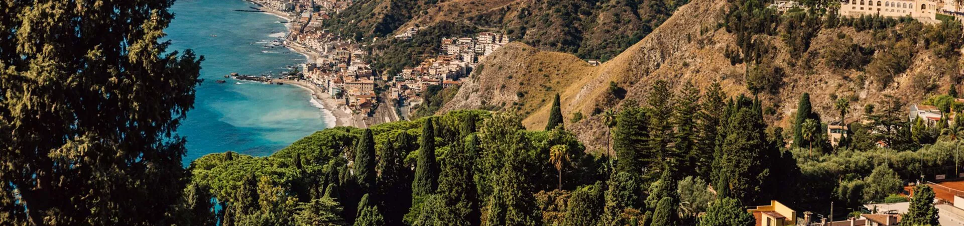 Landscape Of Mountains And A Small City Afar
