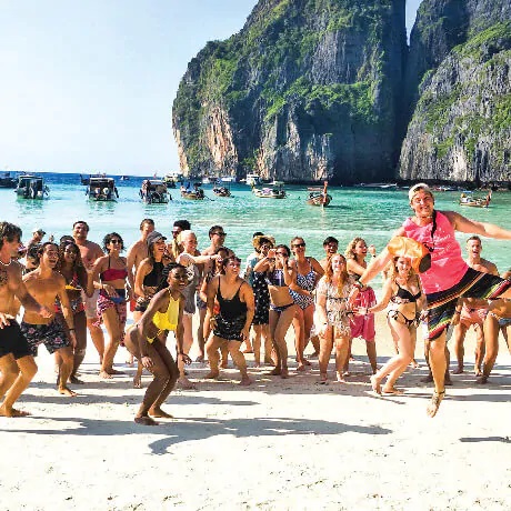 A group of young and joyful people on the beach