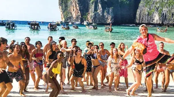 A group of young and joyful people on the beach