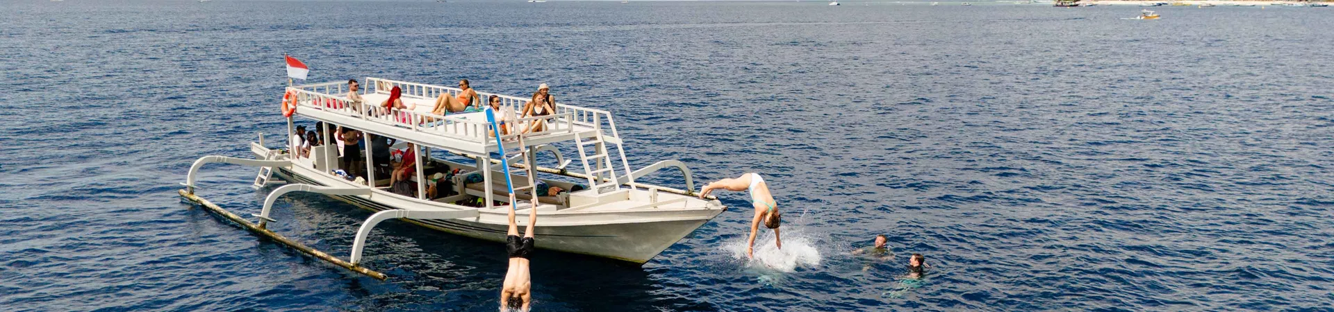 Group Of Young Travelers On Boat Indonesia