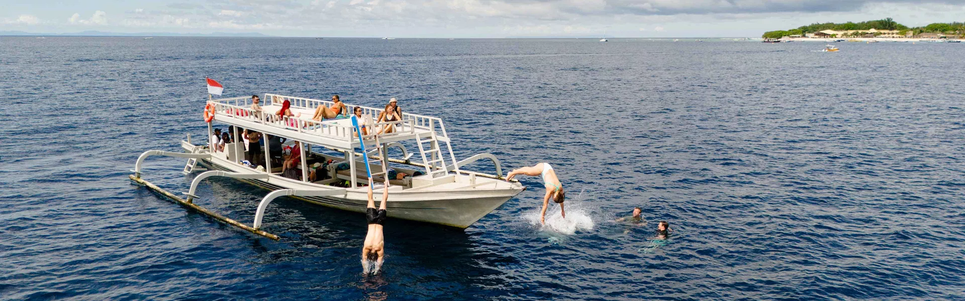 Group Of Young Travelers On Boat Indonesia