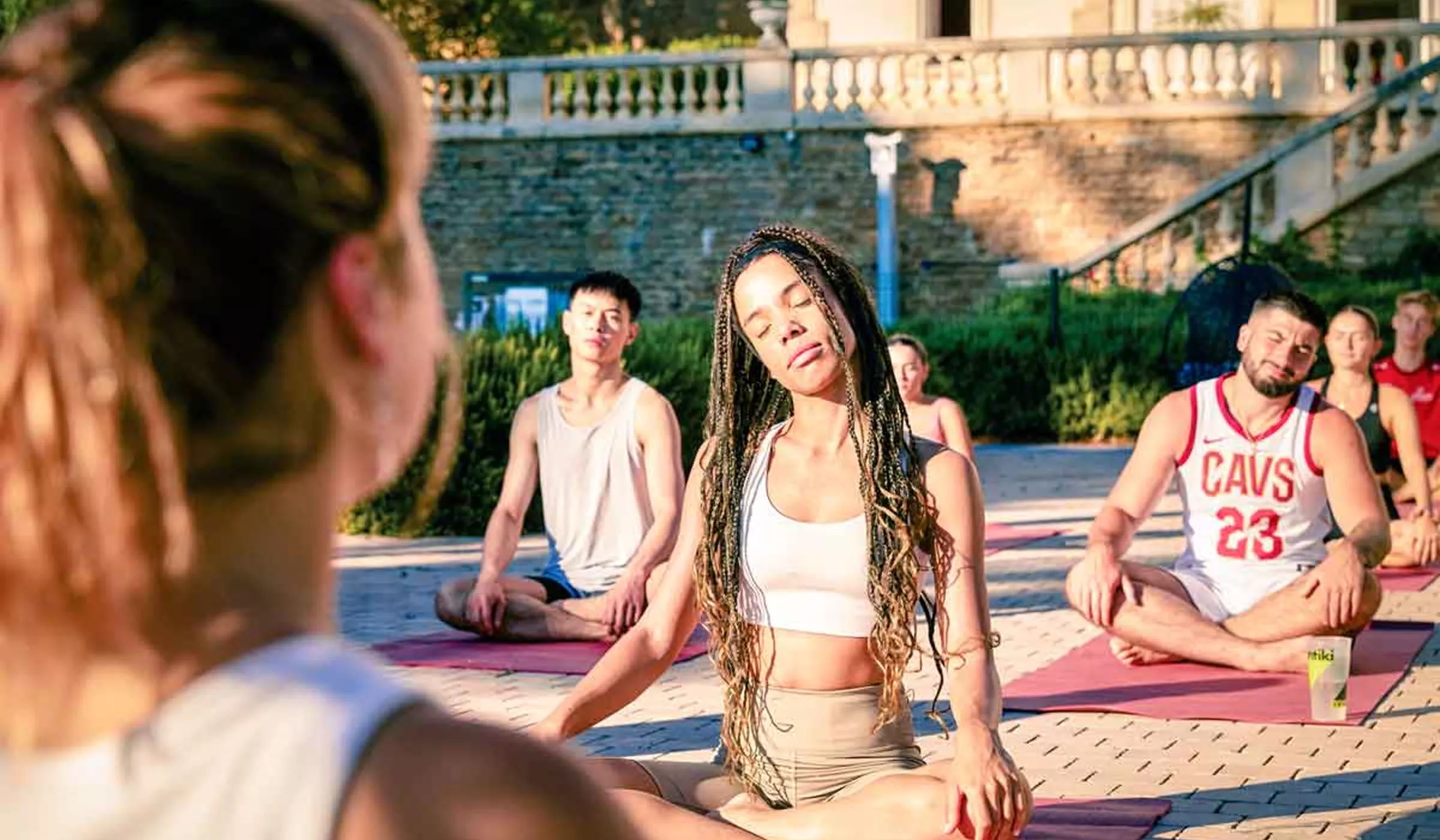 Group Enjoying Yogo Class Outside Chateau France
