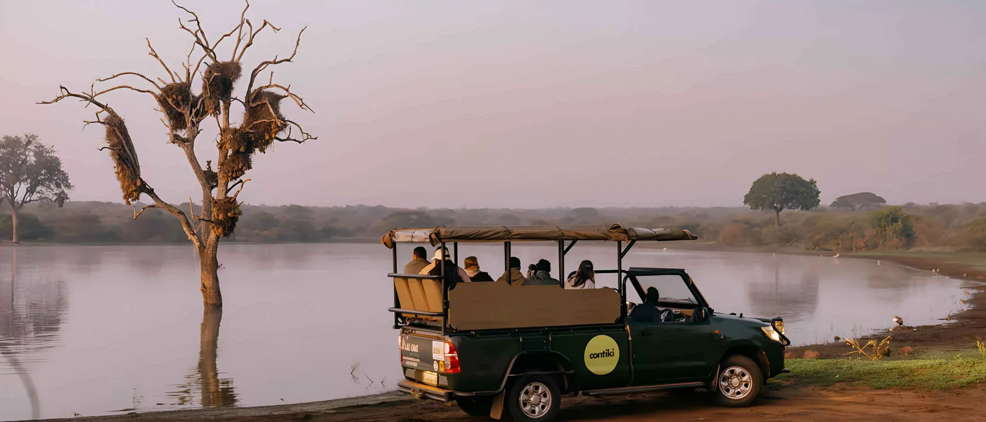 Safari Truck Driving Close To Lake