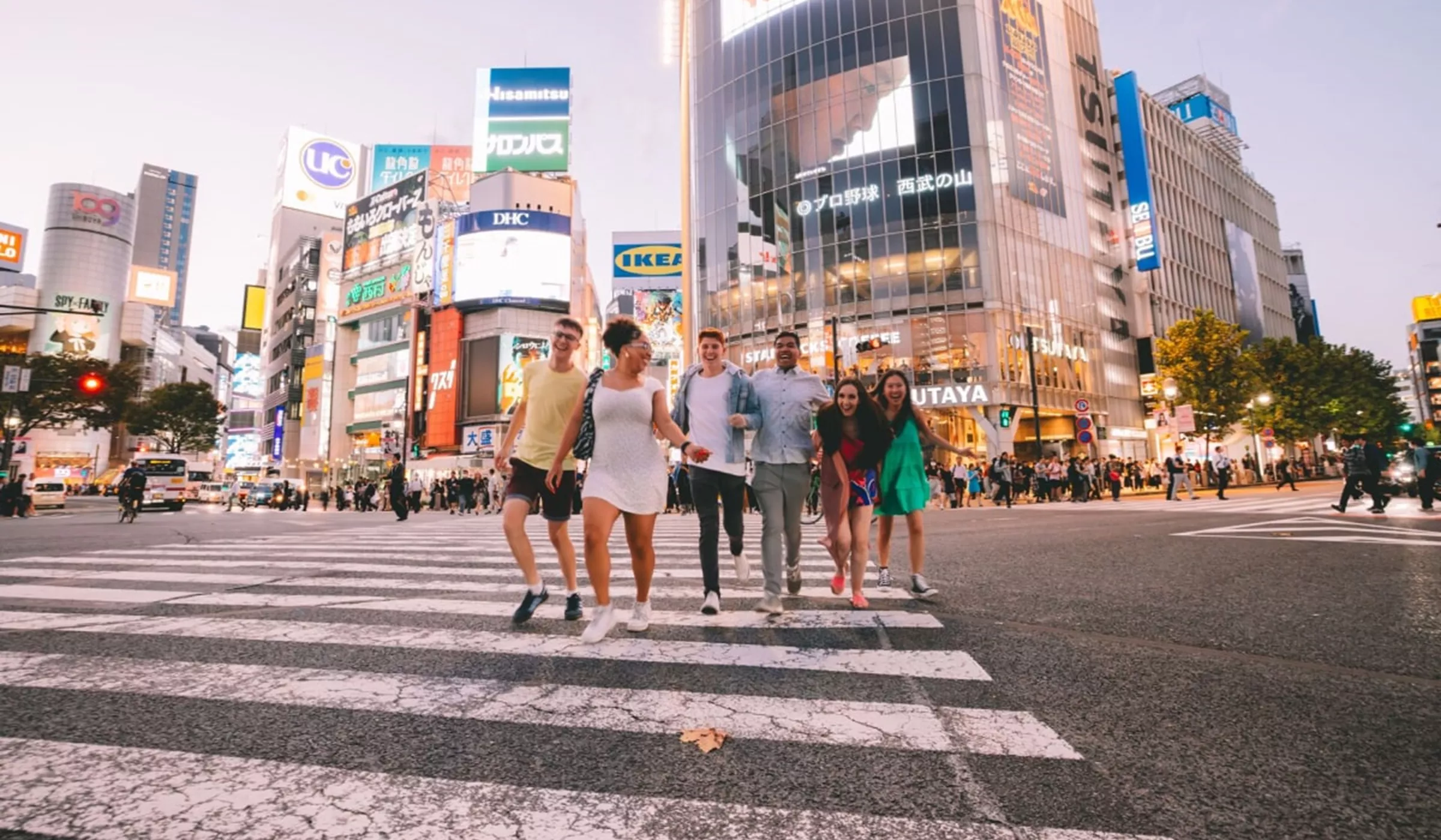 People walking across a cross walk in Harajuku and Shibuya