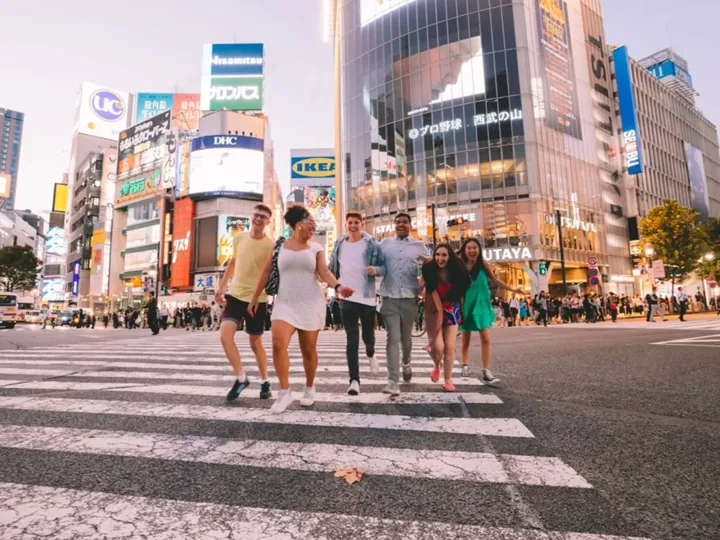 People walking across a cross walk in Harajuku and Shibuya