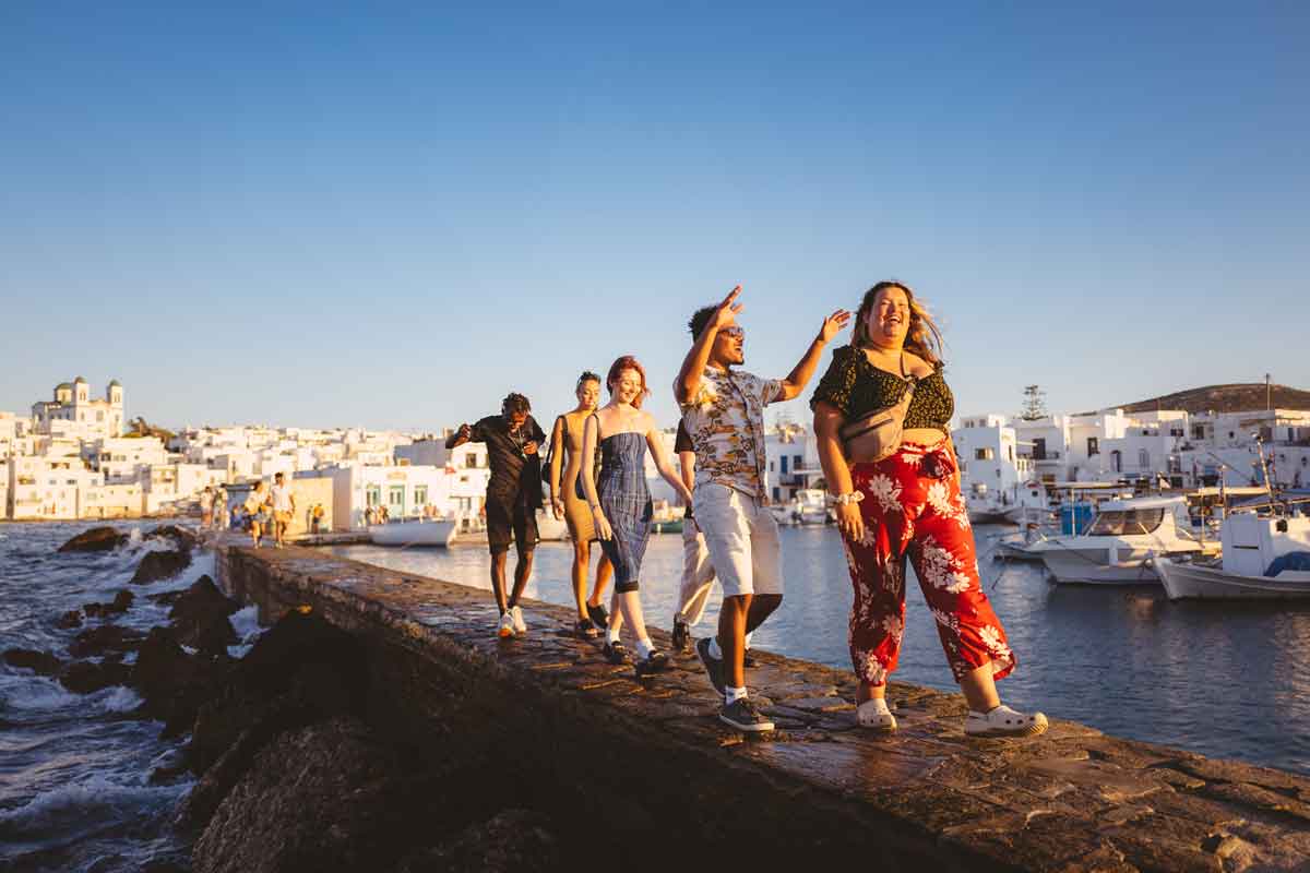 People Walking In Sun Greece