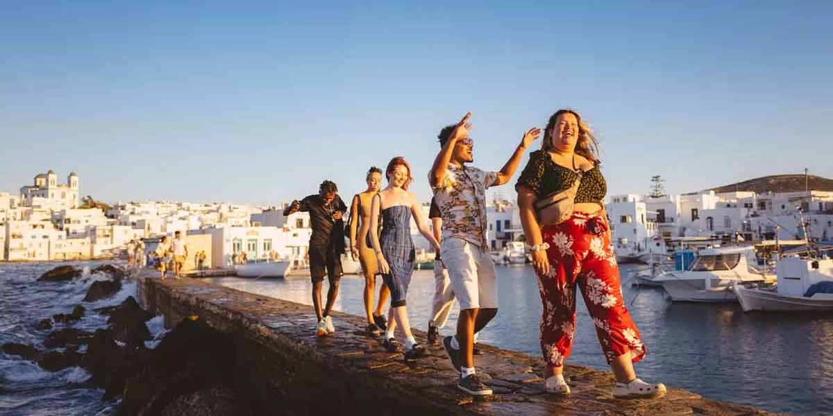 People Walking In Sun Greece