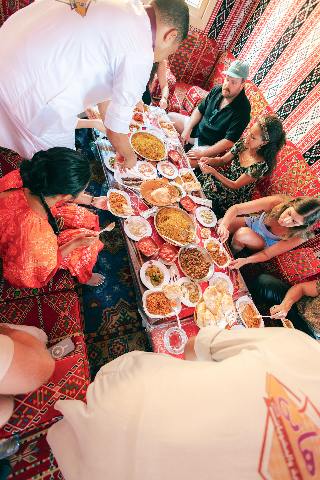 Travellers helping themselves to a spread of Egyptian food, Egypt