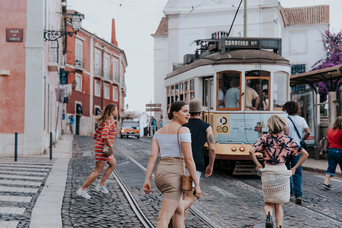 Group Crossing Tram Lines In Portugal
