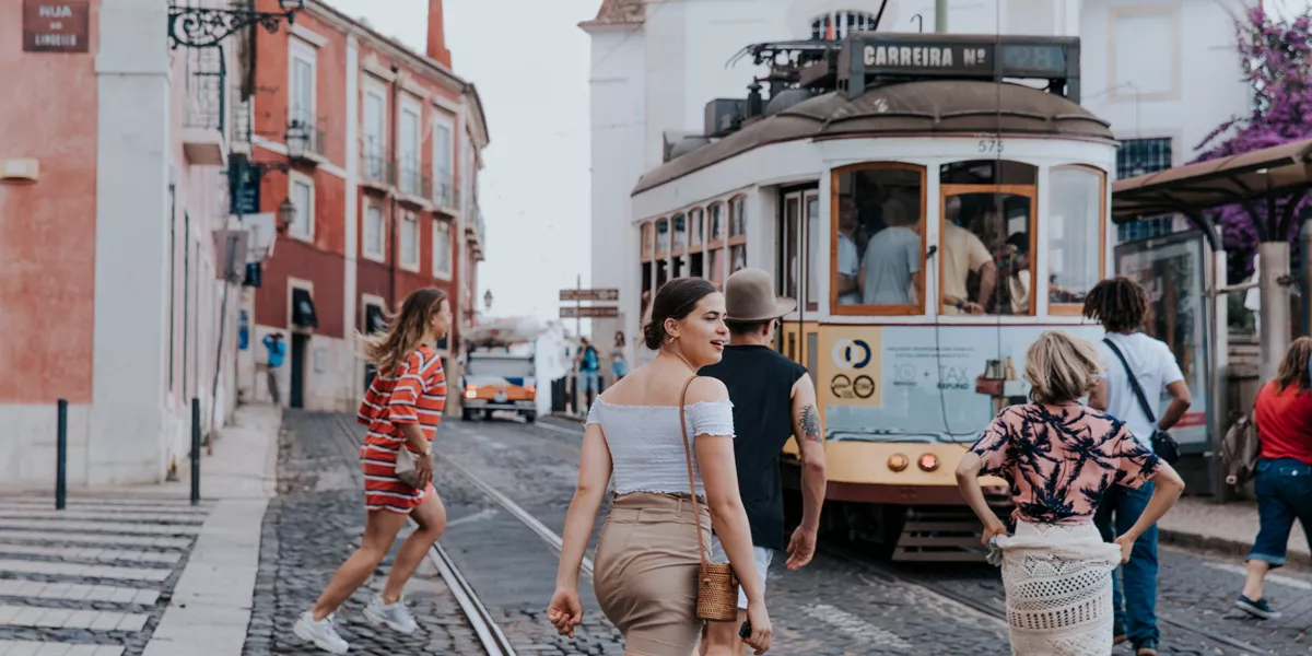 Group Crossing Tram Lines In Portugal