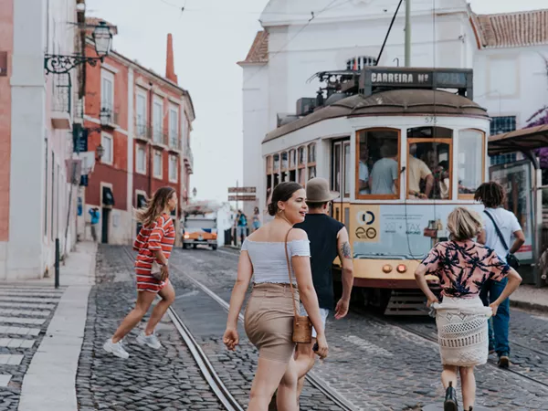 Group Crossing Tram Lines In Portugal