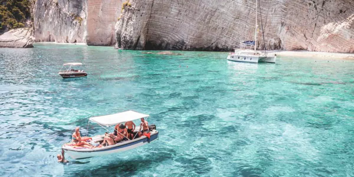 Group On Boat In Clear Blue Seas