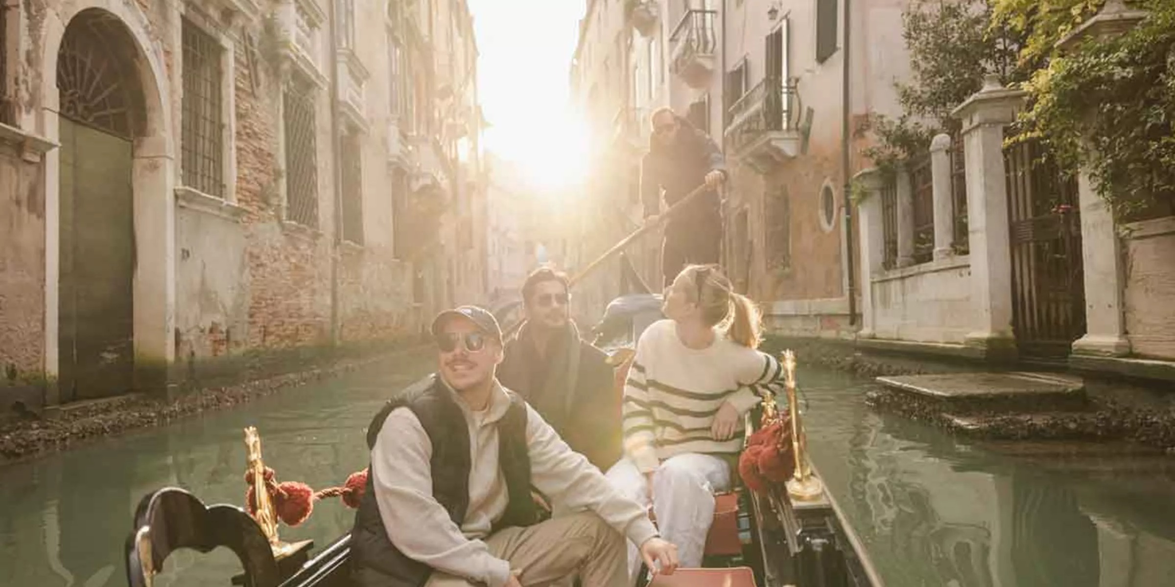 Travellers In Winter In Canals In Venice