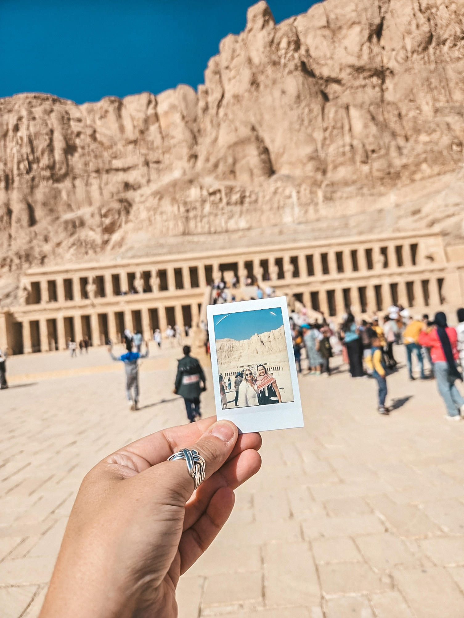 Travellers in front of the Temple of Deir al Bahri in Luxor, Egypt