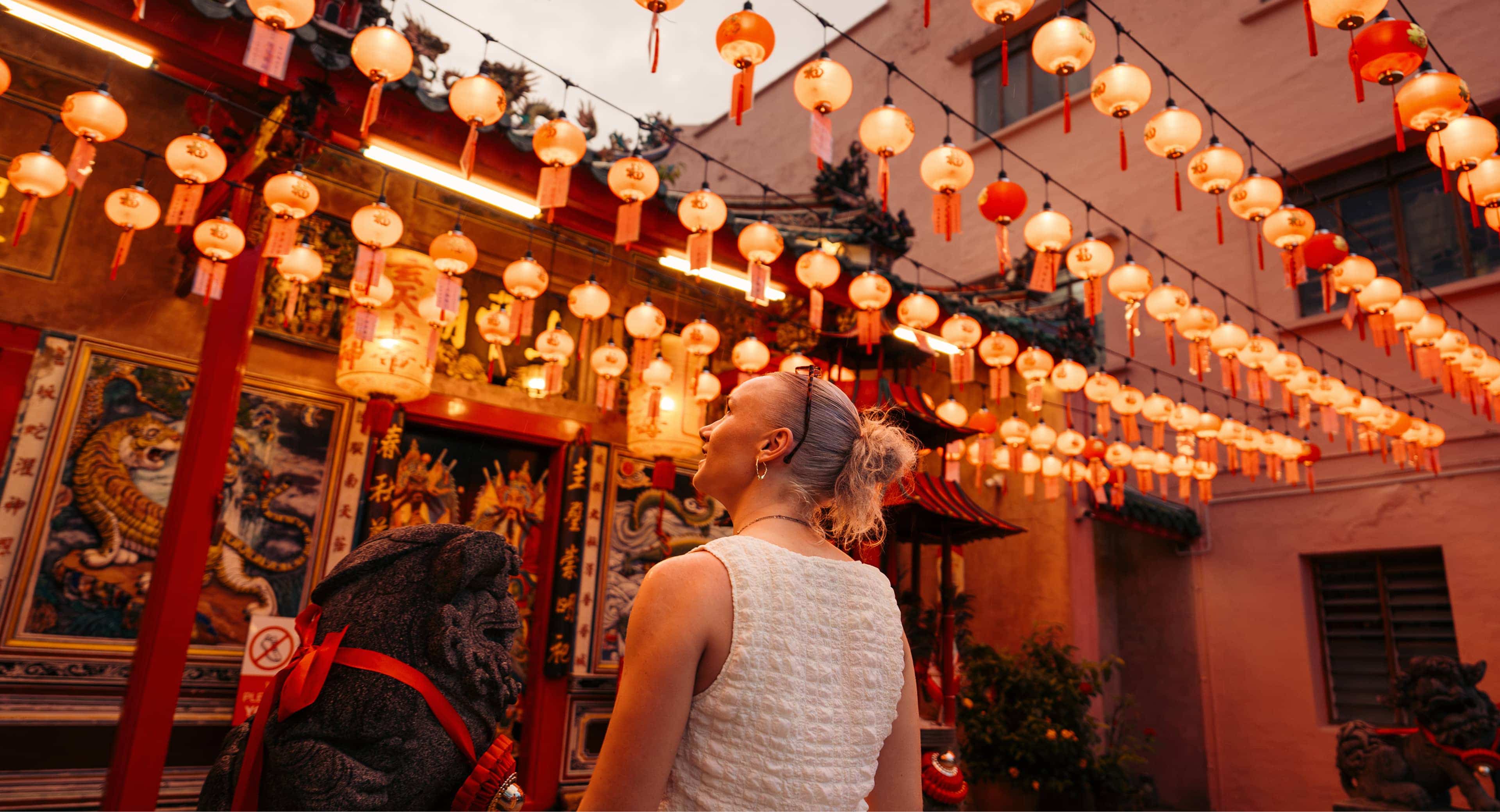 activity-emilygrosser-whycontiki-emily-admiring-red-lanterns-at-temple-borneo.jpg