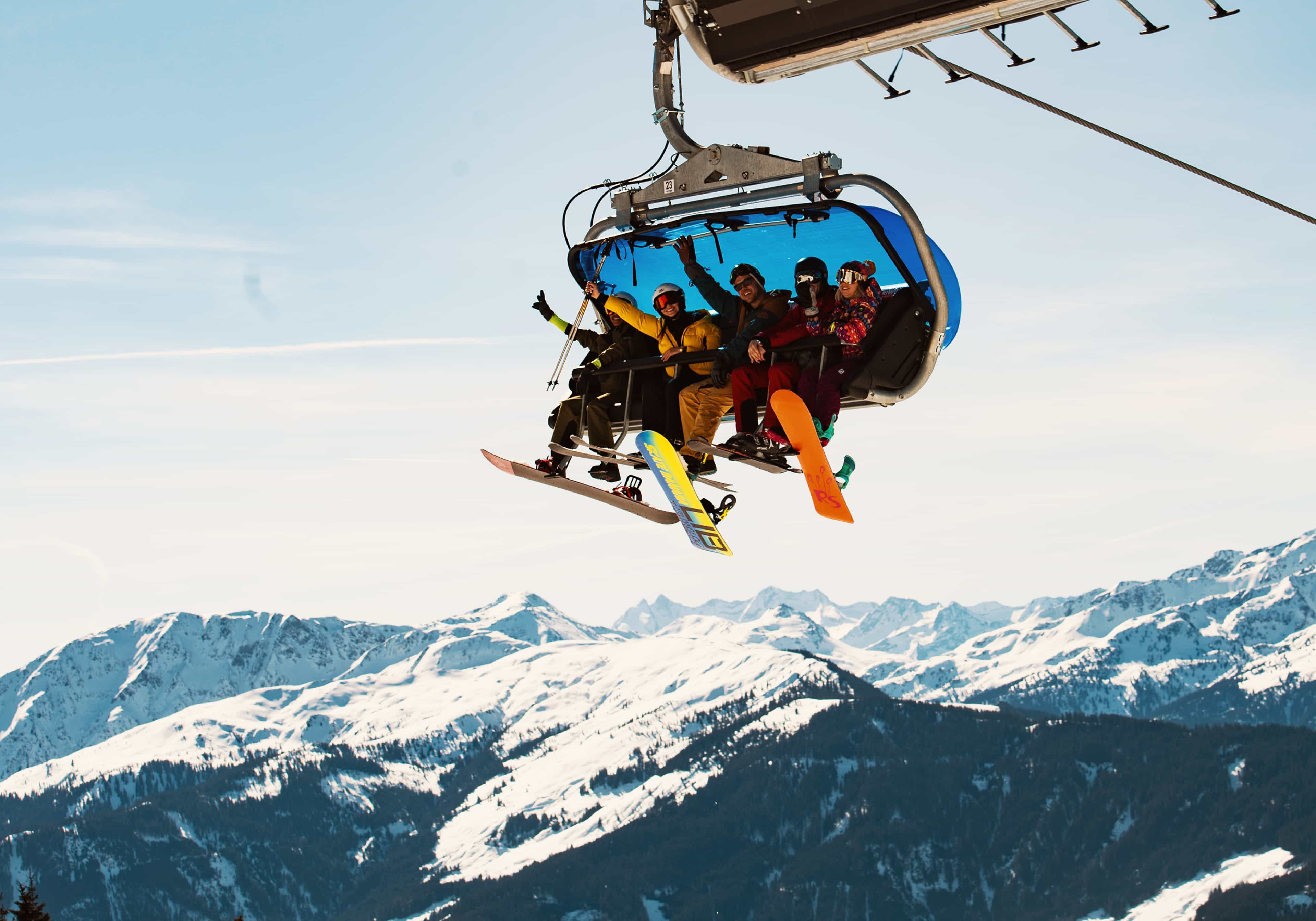 Group Snowboarders Chairlift Europe