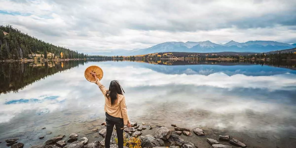 Traveler In Canada Looking Out Over A Lake