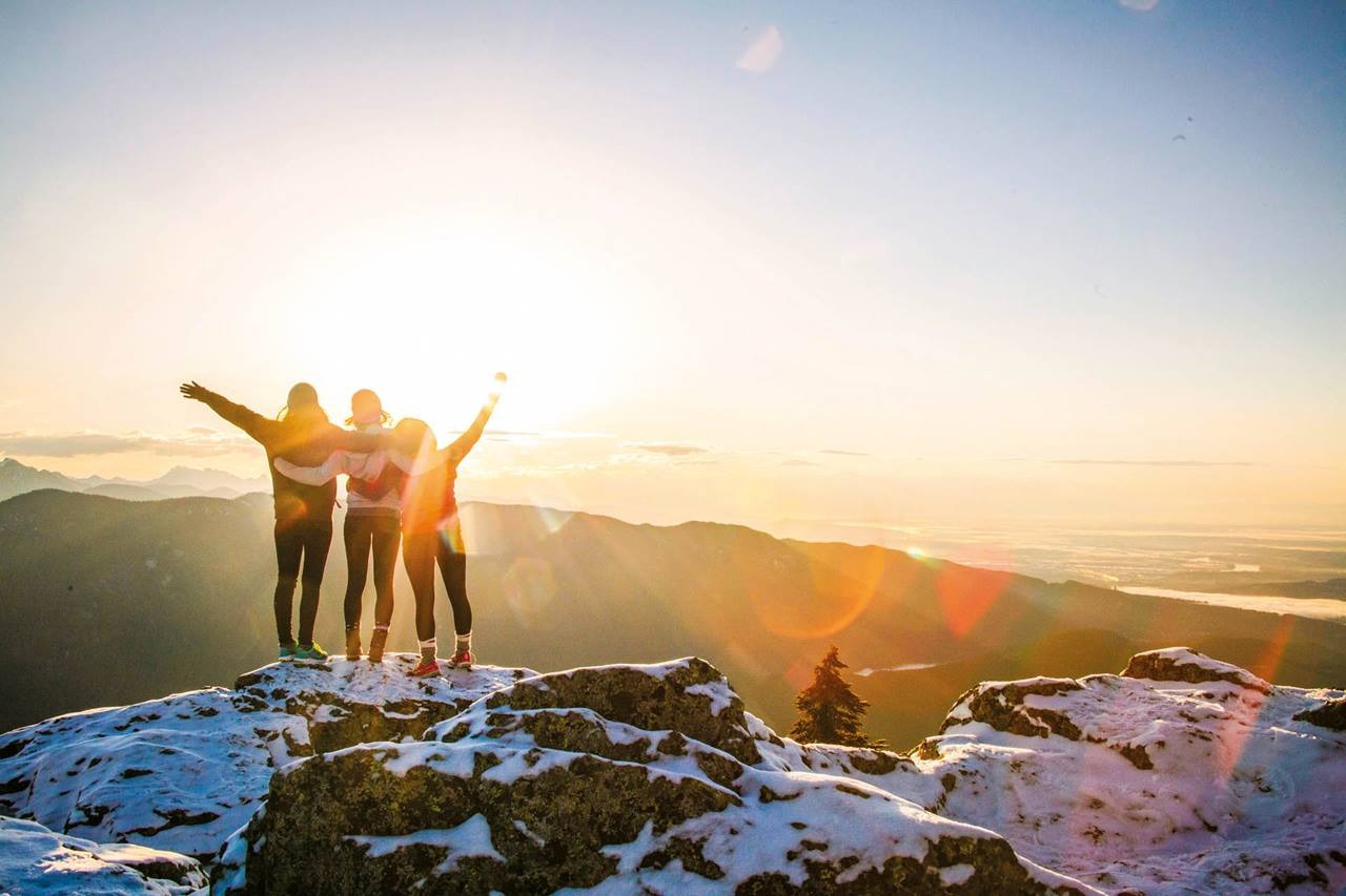 Tourists at the Mountaintop looking at sunset USA