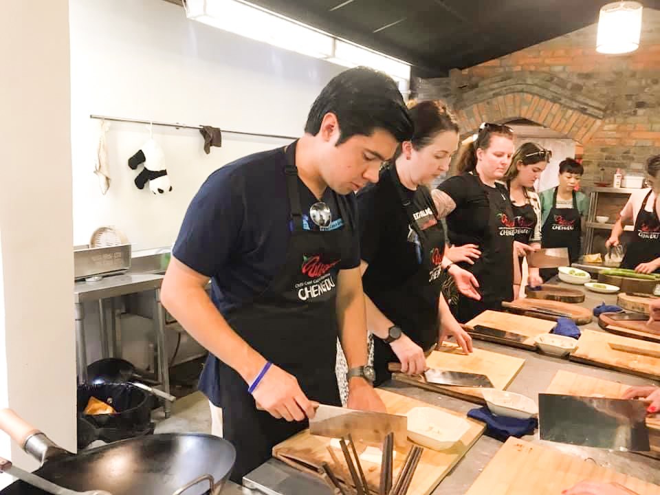 Travellers at a cooking class in Chengdu, China