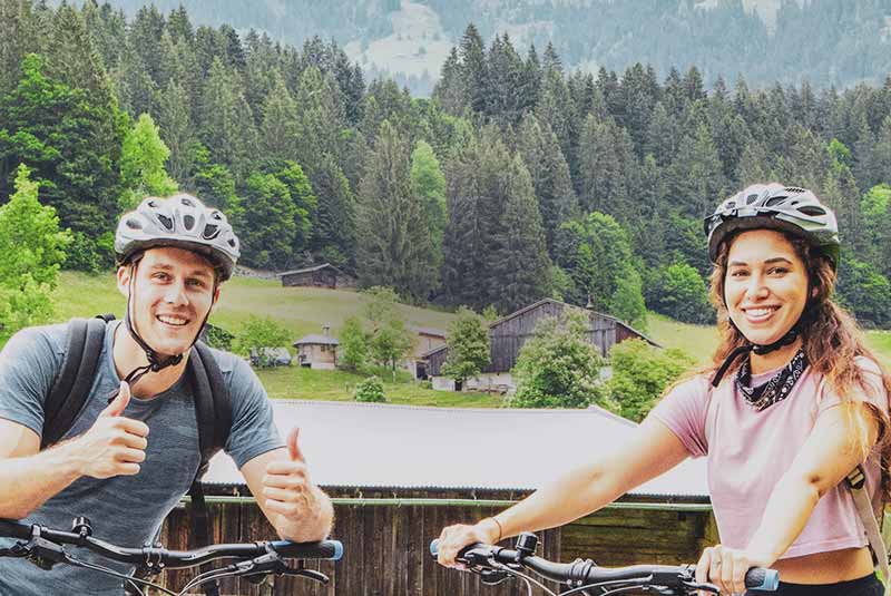 Smilling tourists on bicycles